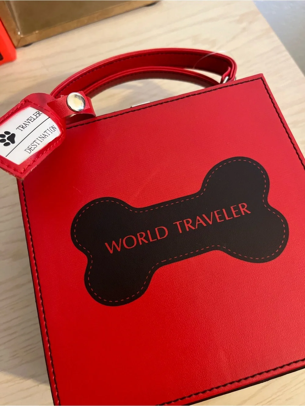 Red 'World Traveler' Dog Bone Handbag Feeder
